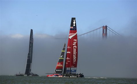 Oracle Team USA (L) sails against Emirates Team New Zealand near the Golden Gate Bridge during the 34th America's Cup yacht sailing race in Oracle Team USA (L) sails against Emirates Team New Zealand near the Golden Gate Bridge during the 34th America's Cup yacht sailing race in