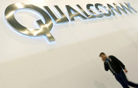 A man walks past a Qualcomm advertising logo at the Mobile World Congress at Barcelona, February 27, 2013. REUTERS/Albert Gea A man walks past a Qualcomm advertising logo at the Mobile World Congress at Barcelona, February 27, 2013. REUTERS/Albert Gea