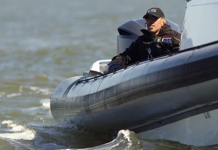 Oracle CEO Larry Ellison watches Oracle Team USA compete against Emirates Team New Zealand during Race 16 of the 34th America's Cup yacht sa Oracle CEO Larry Ellison watches Oracle Team USA compete against Emirates Team New Zealand during Race 16 of the 34th America's Cup yacht sa