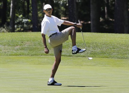 U.S. President Barack Obama reacts after missing a putt on the first green at the Farm Neck Golf Club at Oak Bluffs on Martha's Vineyard, Au U.S. President Barack Obama reacts after missing a putt on the first green at the Farm Neck Golf Club at Oak Bluffs on Martha's Vineyard, Au
