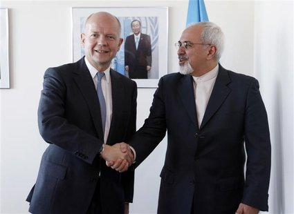 British Foreign Minister William Hague (L). shakes hands with Iran's Foreign Minister Mohammad Javad Zarif at the beginning of their bilater British Foreign Minister William Hague (L). shakes hands with Iran's Foreign Minister Mohammad Javad Zarif at the beginning of their bilater
