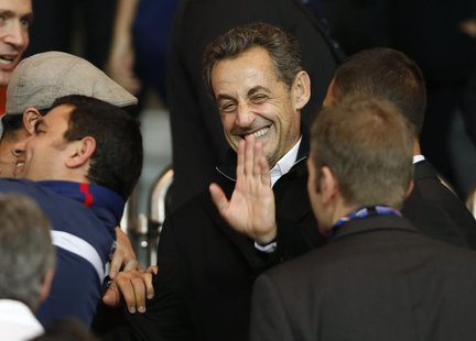 Former French President Nicolas Sarkozy waves as he arrives to attend the Paris St Germain and Monaco French Ligue 1 soccer match at the Par Former French President Nicolas Sarkozy waves as he arrives to attend the Paris St Germain and Monaco French Ligue 1 soccer match at the Par
