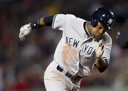 New York Yankees' Curtis Granderson moves to third on a throwing error by Boston Red Sox starting pitcher Clay Buchholz during the first inn New York Yankees' Curtis Granderson moves to third on a throwing error by Boston Red Sox starting pitcher Clay Buchholz during the first inn