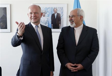 British Foreign Minister William Hague (L). gestures as he meets with Iran's Foreign Minister Mohammad Javad Zarif at the beginning of their British Foreign Minister William Hague (L). gestures as he meets with Iran's Foreign Minister Mohammad Javad Zarif at the beginning of their