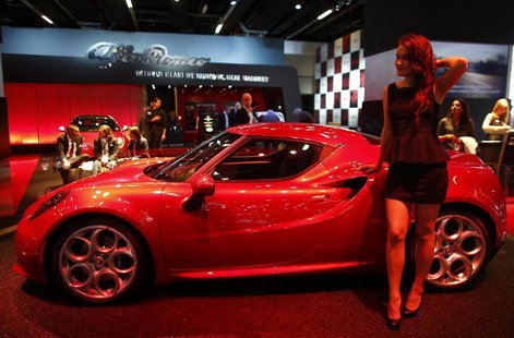 A model stands next to a Alfa Romeo 4C during a media preview day at the Frankfurt Motor Show (IAA) September 10, 2013. REUTERS/Pawel Kopczy A model stands next to a Alfa Romeo 4C during a media preview day at the Frankfurt Motor Show (IAA) September 10, 2013. REUTERS/Pawel Kopczy