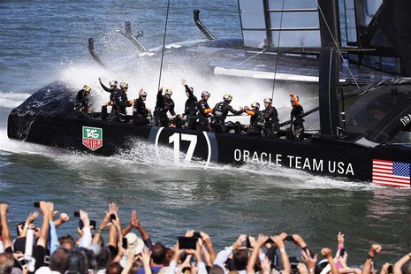 Members of Oracle Team USA wave to spectators after winning Race 16 of the 34th America's Cup yacht sailing race against Emirates Team New Z Members of Oracle Team USA wave to spectators after winning Race 16 of the 34th America's Cup yacht sailing race against Emirates Team New Z