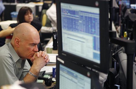 A broker waits for a phone call as he trades on the dealing floor at ICAP in Jersey City, New Jersey December 9, 2009. REUTERS/Lucas Jackson A broker waits for a phone call as he trades on the dealing floor at ICAP in Jersey City, New Jersey December 9, 2009. REUTERS/Lucas Jackson