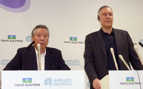 Tokyo Electron Ltd Chairman and President Tetsuro Higashi (L) and Applied Materials Inc Chief Executive Officer Gary Dickerson attend their Tokyo Electron Ltd Chairman and President Tetsuro Higashi (L) and Applied Materials Inc Chief Executive Officer Gary Dickerson attend their