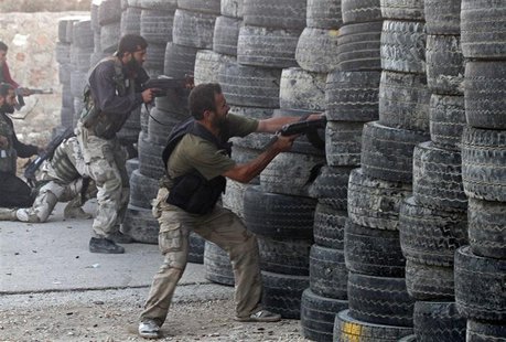 Free Syrian Army fighters fire their weapons during clashes with what activists say are government forces, in the village of Aziza, in the s Free Syrian Army fighters fire their weapons during clashes with what activists say are government forces, in the village of Aziza, in the s