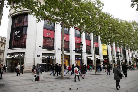 People walk near the Virgin Megastore building on the Champs Elysees in Paris May 14, 2013. REUTERS/Benoit Tessier People walk near the Virgin Megastore building on the Champs Elysees in Paris May 14, 2013. REUTERS/Benoit Tessier
