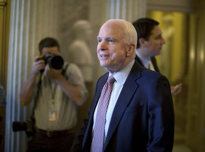 U.S. Senator John McCain (R-AZ) leaves the Senate chamber after fellow Republican Senator Ted Cruz (not Pictured) held a marathon attack on U.S. Senator John McCain (R-AZ) leaves the Senate chamber after fellow Republican Senator Ted Cruz (not Pictured) held a marathon attack on