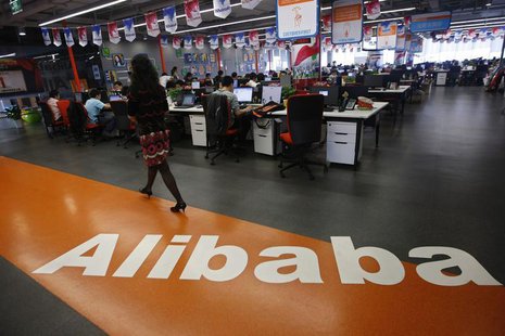 An employee walks past a logo of Alibaba Group at its headquarters on the outskirts of Hangzhou, Zhejiang province, in this May 17, 2010 fil An employee walks past a logo of Alibaba Group at its headquarters on the outskirts of Hangzhou, Zhejiang province, in this May 17, 2010 fil