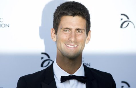 Serbian tennis player Novak Djokovic poses for photographers as he arrives at a fundraising dinner for the Novak Djokovic Foundation in Lond Serbian tennis player Novak Djokovic poses for photographers as he arrives at a fundraising dinner for the Novak Djokovic Foundation in Lond