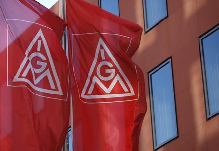 Flags of Germany's metalworkers' union IG Metall (IGM) are pictured past the IGM headquarters in Frankfurt May 3, 2012. REUTERS/Ralph Orlows Flags of Germany's metalworkers' union IG Metall (IGM) are pictured past the IGM headquarters in Frankfurt May 3, 2012. REUTERS/Ralph Orlows
