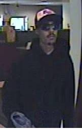 The bank robbery suspect as seen in images taken from surveillance footage. The bank robbery suspect as seen in images taken from surveillance footage.