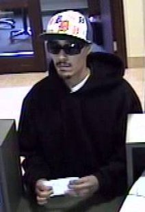 The bank robbery suspect as seen in images taken from surveillance footage. The bank robbery suspect as seen in images taken from surveillance footage.