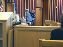 Officer Jason Pacey shows jury victim's blood stained shirt Officer Jason Pacey shows jury victim's blood stained shirt