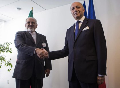Iran's Foreign Minister Mohammad Javad Zarif (L) shakes hands with French Foreign Minister Laurent Fabius during the UN General Assembly at Iran's Foreign Minister Mohammad Javad Zarif (L) shakes hands with French Foreign Minister Laurent Fabius during the UN General Assembly at