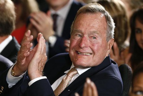 Former President George H. W. Bush applauds during an event to honor the winner of the 5,000th Daily Point of Light Award at the White House Former President George H. W. Bush applauds during an event to honor the winner of the 5,000th Daily Point of Light Award at the White House