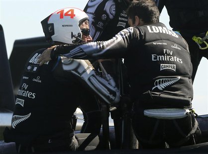 Emirates New Zealand skipper Dean Barker (L) is consoled by a crew member after losing the winner-take-all Race 19 of the 34th Americas Cup Emirates New Zealand skipper Dean Barker (L) is consoled by a crew member after losing the winner-take-all Race 19 of the 34th Americas Cup