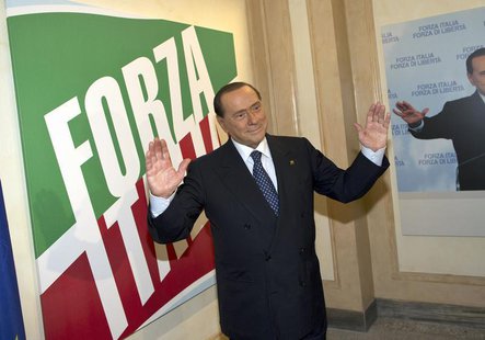 Former Italian leader Silvio Berlusconi stands inside the new headquarters of his re-launched original political party, Forza Italia (Go Ita Former Italian leader Silvio Berlusconi stands inside the new headquarters of his re-launched original political party, Forza Italia (Go Ita