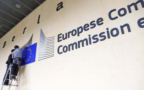 Workers adjust and clean the logo of the European Commission at the entrance of the Berlaymont building, the EC headquarters, in Brussels Se Workers adjust and clean the logo of the European Commission at the entrance of the Berlaymont building, the EC headquarters, in Brussels Se