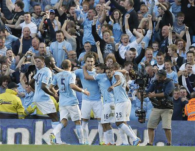 Manchester City's Sergio Aguero (16) celebrates with teamates after scoring against Manchester United during their English Premier League so Manchester City's Sergio Aguero (16) celebrates with teamates after scoring against Manchester United during their English Premier League so