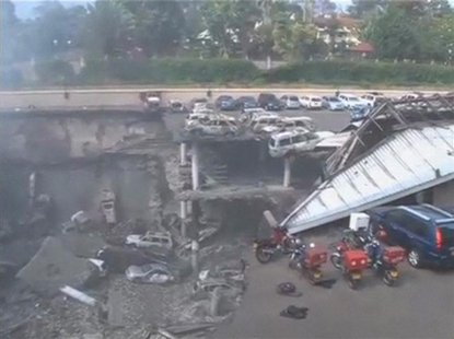 Debris and destroyed vehicles are seen at the collapsed Westgate shopping mall in Nairobi, in this still image taken from video shot Septemb Debris and destroyed vehicles are seen at the collapsed Westgate shopping mall in Nairobi, in this still image taken from video shot Septemb