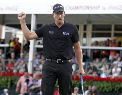 Henrik Stenson of Sweden reacts after sinking his putt to win the Tour Championship golf tournament and the FedExCup at East Lake Golf Club Henrik Stenson of Sweden reacts after sinking his putt to win the Tour Championship golf tournament and the FedExCup at East Lake Golf Club
