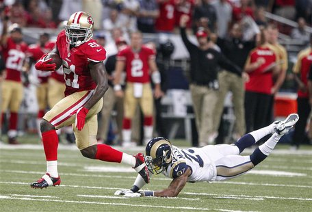 San Francisco 49ers running back Frank Gore (L) gets past St. Louis Rams free safety Rodney McLeod to run in a touchdown during the first ha San Francisco 49ers running back Frank Gore (L) gets past St. Louis Rams free safety Rodney McLeod to run in a touchdown during the first ha