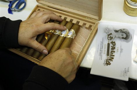 Niurka Perez packs a box of cigars at the El Titan de Bronze cigar factory and store in the Little Havana neighborhood of Miami, Florida Sep Niurka Perez packs a box of cigars at the El Titan de Bronze cigar factory and store in the Little Havana neighborhood of Miami, Florida Sep