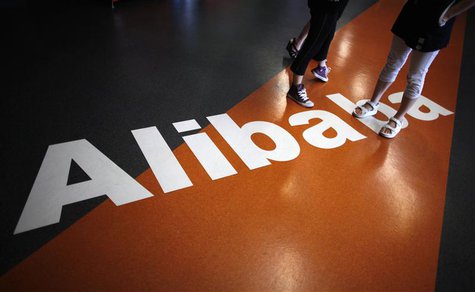 Employees stand on a logo of Alibaba (China) Technology Co. Ltd during a media tour organised by government officials at its headquarters on Employees stand on a logo of Alibaba (China) Technology Co. Ltd during a media tour organised by government officials at its headquarters on