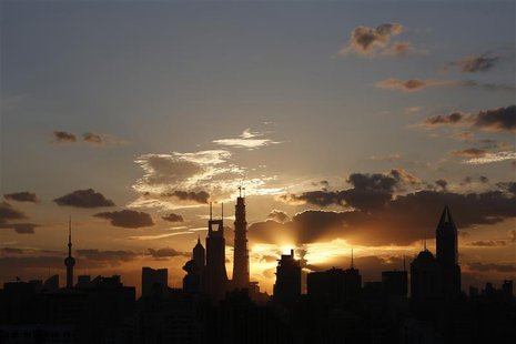 The sunrise rises over the skyline of Lujiazui financial district of Pudong in Shanghai September 27, 2013. REUTERS/Aly Song The sunrise rises over the skyline of Lujiazui financial district of Pudong in Shanghai September 27, 2013. REUTERS/Aly Song