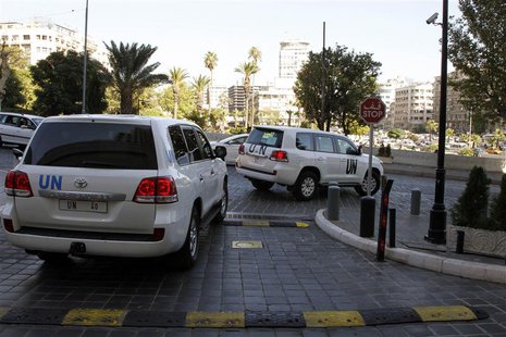 United Nations (U.N.) vehicles transport a team of U.N. chemical weapons experts in Damascus September 26, 2013. REUTERS/Khaled al-Hariri United Nations (U.N.) vehicles transport a team of U.N. chemical weapons experts in Damascus September 26, 2013. REUTERS/Khaled al-Hariri