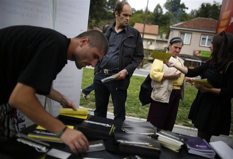 Volunteers hand out leaflets with information about new Bosnia's census in Jablanica, 60 kilometres (37 miles) south of Sarajevo, September Volunteers hand out leaflets with information about new Bosnia's census in Jablanica, 60 kilometres (37 miles) south of Sarajevo, September