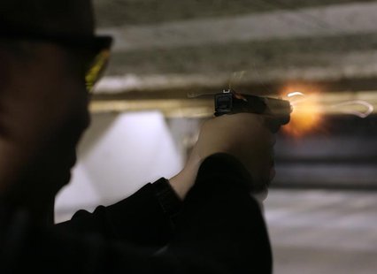 An unidentified man fires his Glock 9 mm pistol at the Maryland Small Arms Range in Upper Marlboro, Maryland, just outside Washington, April An unidentified man fires his Glock 9 mm pistol at the Maryland Small Arms Range in Upper Marlboro, Maryland, just outside Washington, April
