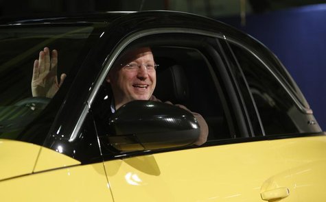 General Motors Vice Chairman, interim President of GM Europe and Chairman of the Opel Supervisory Board Steve Girsky waves as he sits inside General Motors Vice Chairman, interim President of GM Europe and Chairman of the Opel Supervisory Board Steve Girsky waves as he sits inside