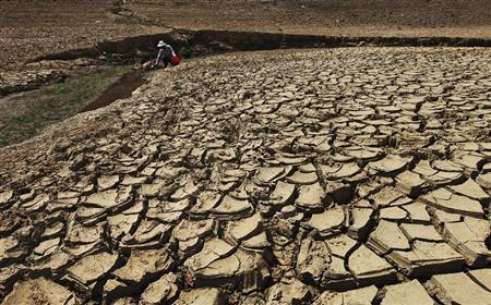 A man fetches water from a partially dried-up reservoir in Taizhou, Zhejiang province August 17, 2013.
REUTERS/Stringer A man fetches water from a partially dried-up reservoir in Taizhou, Zhejiang province August 17, 2013.
REUTERS/Stringer