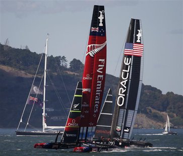 Emirates Team New Zealand (L) sails against Oracle Team USA during Race 19 of the 34th America's Cup yacht sailing race in San Francisco, Ca Emirates Team New Zealand (L) sails against Oracle Team USA during Race 19 of the 34th America's Cup yacht sailing race in San Francisco, Ca