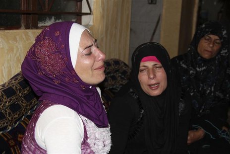 Women mourn the death of family members who died on a boat that sank off the Indonesian coast, in Akkar September 27, 2013. REUTERS/Stringer Women mourn the death of family members who died on a boat that sank off the Indonesian coast, in Akkar September 27, 2013. REUTERS/Stringer