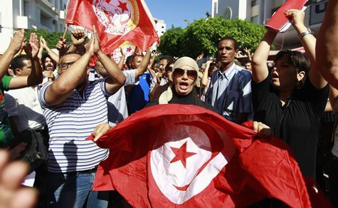 Anti-government protesters wave Tunisian flags as they rally for the dissolution of the Islamist-led government in Sfax, 170 miles (270 km) Anti-government protesters wave Tunisian flags as they rally for the dissolution of the Islamist-led government in Sfax, 170 miles (270 km)