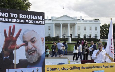 Iranian Americans protest against a conversation between U.S. President Barack Obama and new Iranian President Hassan Rouhani, outside the W Iranian Americans protest against a conversation between U.S. President Barack Obama and new Iranian President Hassan Rouhani, outside the W