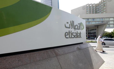 A man walks past a sign at the headquarters of telecommunications company Etisalat in Dubai October 25, 2011. REUTERS/Jumana El Heloueh A man walks past a sign at the headquarters of telecommunications company Etisalat in Dubai October 25, 2011. REUTERS/Jumana El Heloueh
