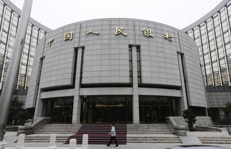 A staff member walks in front of the headquarters of the People's Bank of China (PBOC), the central bank, in Beijing, June 25, 2013. REUTERS A staff member walks in front of the headquarters of the People's Bank of China (PBOC), the central bank, in Beijing, June 25, 2013. REUTERS