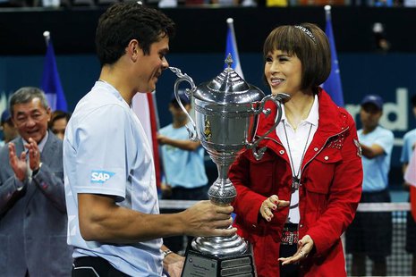 Thai Princess Ubolratana Rajakanya (R) presents the winner's trophy to Milos Raonic of Canada after the men's singles final match at the Tha Thai Princess Ubolratana Rajakanya (R) presents the winner's trophy to Milos Raonic of Canada after the men's singles final match at the Tha