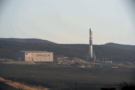 A SpaceX upgraded Falcon 9 rocket undergoes launch preparations at Vandenberg Air Force Base in California September 27, 2013. REUTERS/Gene A SpaceX upgraded Falcon 9 rocket undergoes launch preparations at Vandenberg Air Force Base in California September 27, 2013. REUTERS/Gene