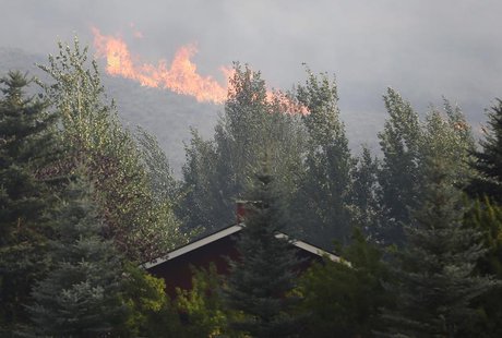 Flames are visible near a home in the evacuated Golden Eagle subdivision as the Beaver Creek wildfire rages outside Hailey, Idaho August 16, Flames are visible near a home in the evacuated Golden Eagle subdivision as the Beaver Creek wildfire rages outside Hailey, Idaho August 16,