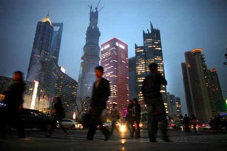 People walk along a busy street at Pudong financial district in Shanghai, March 27, 2013. REUTERS/Carlos Barria People walk along a busy street at Pudong financial district in Shanghai, March 27, 2013. REUTERS/Carlos Barria