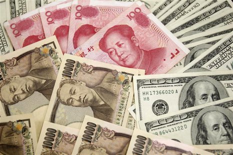 Japanese 10,000 yen notes (L) featuring a portrait of Yukichi Fukuzawa, the founding father of modern Japan, $100 notes, featuring an image Japanese 10,000 yen notes (L) featuring a portrait of Yukichi Fukuzawa, the founding father of modern Japan, $100 notes, featuring an image
