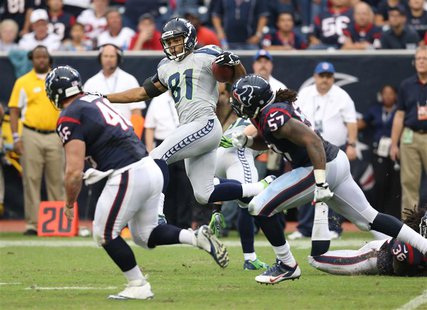 Sep 29, 2013; Houston, TX, USA; Seattle Seahawks receiver Golden Tate (81) leaps as he returns a punt in overtime against the Houston Texans Sep 29, 2013; Houston, TX, USA; Seattle Seahawks receiver Golden Tate (81) leaps as he returns a punt in overtime against the Houston Texans